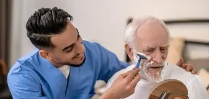 Joyous young man helping elderly patient